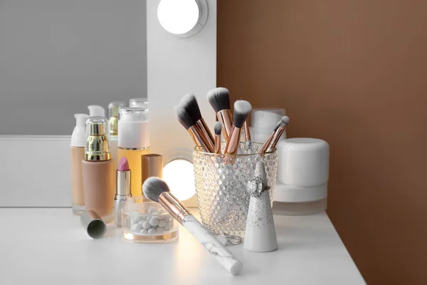 Holder Makeup Brushes Decorative Cosmetics Rings Table Beige Wall — Stock Photo, Image