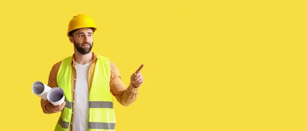 Builder Drawings Pointing Something Yellow Background Space Text — Stock Photo, Image