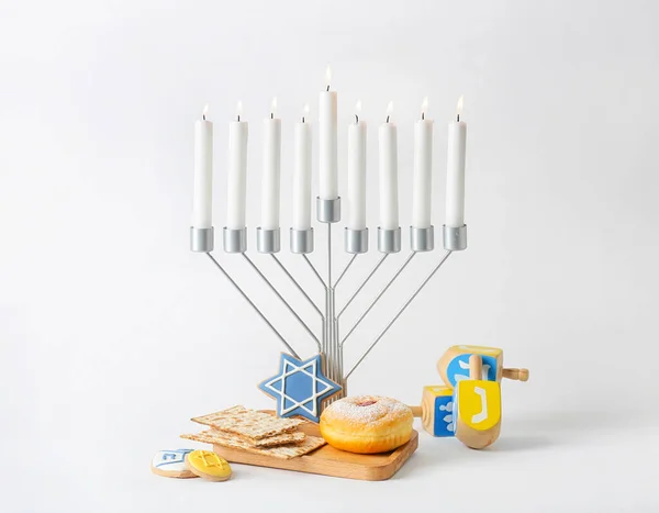 Menorah Candles Wooden Dreidels Delicious Food Hanukkah Celebration Light Background — Stock Photo, Image