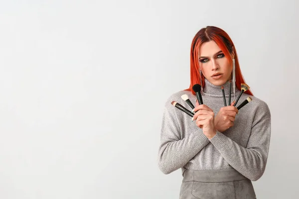 Stylish Transgender Woman Makeup Brushes Light Background — Stock Photo, Image