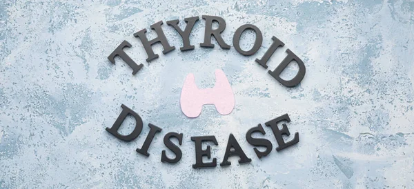 Text THYROID DISEASE on blue background