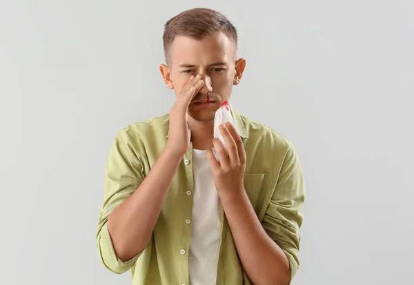 Young Man Nosebleed Tissue White Background — стоковое фото