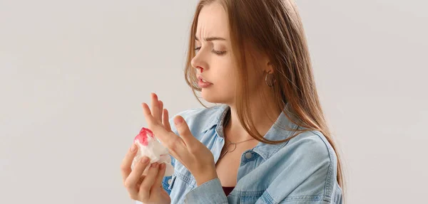 Young Woman Nosebleed Tissue Light Background — Stock Photo, Image