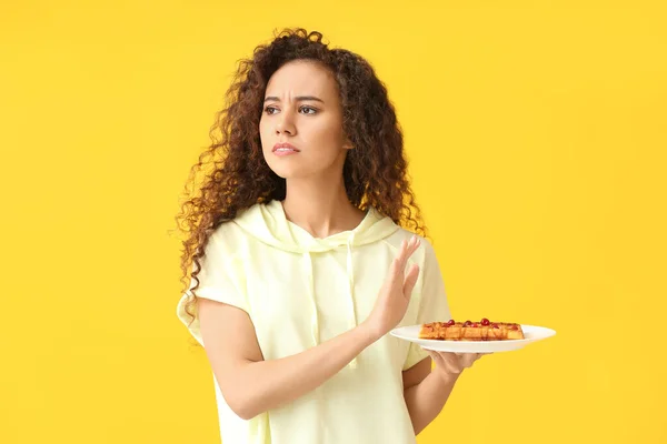Young African American Woman Refusing Pastry Yellow Background Diet Concept — Stock Photo, Image