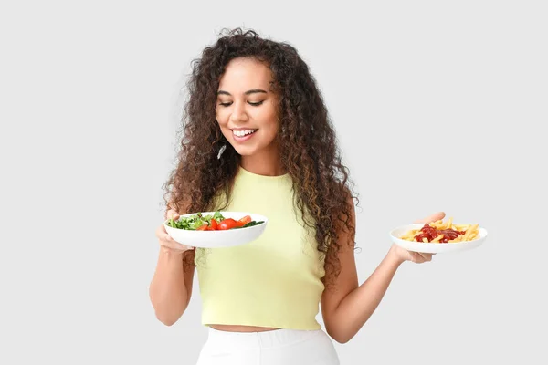 Happy Young African American Woman Healthy Unhealthy Food Light Background — Stock Photo, Image