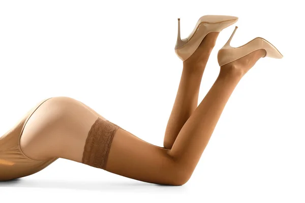 Nohy Krásné Mladé Ženy Béžové Punčochy Bílém Pozadí — Stock fotografie