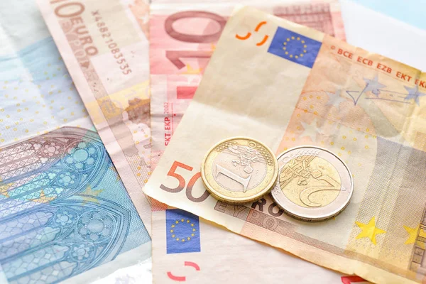 Euro Banknotes Coins Blue Background Closeup Exchange Rate Concept — Stock Photo, Image