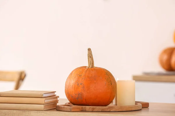 Board Fresh Pumpkin Burning Candles Books Counter Kitchen — Stock Photo, Image