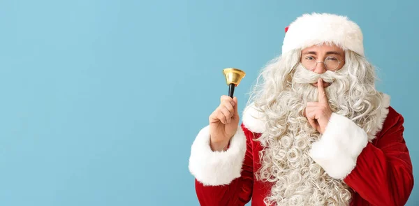 Santa Claus Christmas Bell Showing Silence Gesture Light Blue Background — Stock Photo, Image