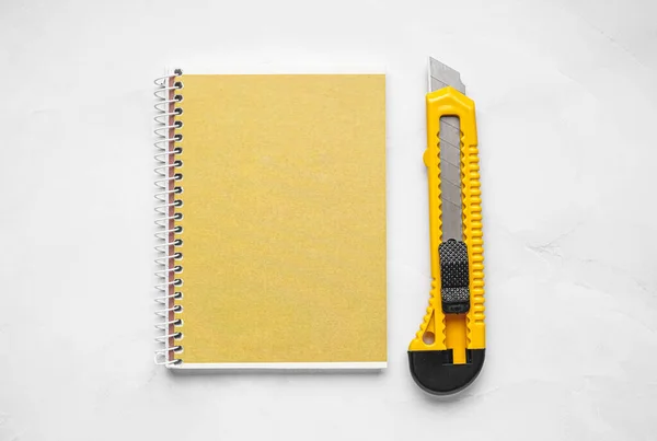 Utility Knife Notebook White Background — Stock Photo, Image