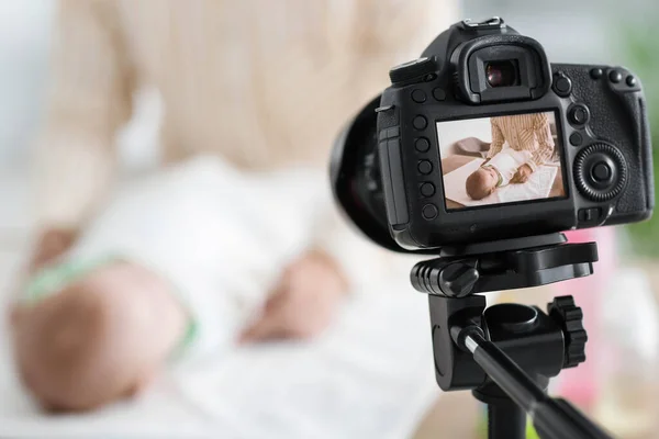 Young Woman Swaddling Baby Screen Photo Camera Home Closeup — Stock Photo, Image