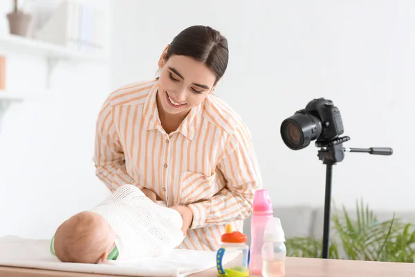 Young Woman Swaddling Baby While Recording Video Course Home — Stock Photo, Image