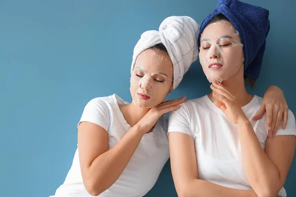 Beautiful Young Women Sheet Facial Masks Blue Background — Stock Photo, Image