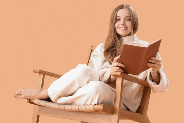 Young Woman Book Sitting Armchair Beige Background — Stock Photo, Image