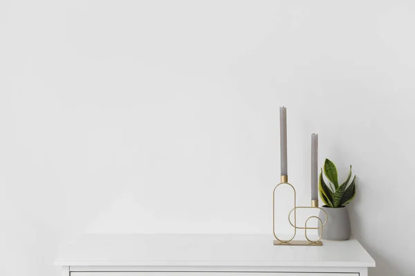 Stylish Holder Candles Houseplant Chest Drawers White Wall — Stock Photo, Image
