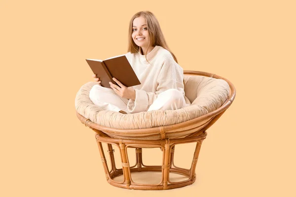 Young Woman Book Sitting Armchair Beige Background — Stock Photo, Image