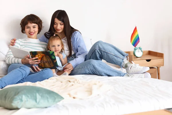 Lesbian Couple Reading Story Little Daughter Bedroom — Stock Photo, Image