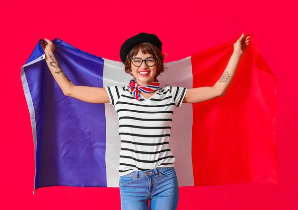 Mujer Joven Con Bandera Francia Sobre Fondo Rojo —  Fotos de Stock