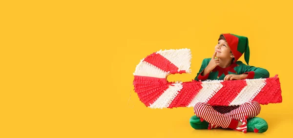 Cute Little Boy Dressed Elf Candy Cane Pinata Yellow Background — Stock Photo, Image
