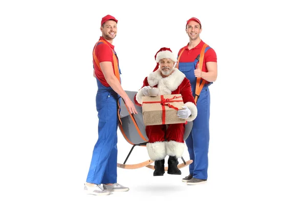 Male Loaders Carrying Armchair Santa Claus Which Holding Gift White — Stock Photo, Image