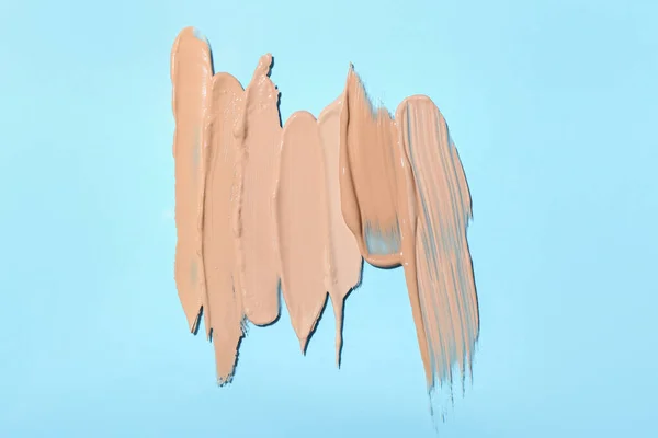 Smears Makeup Foundation Blue Background — Stock Photo, Image