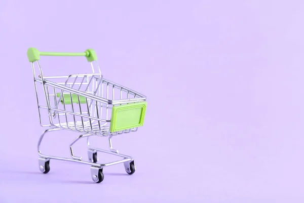 緑のショッピングカートの色の背景 — ストック写真