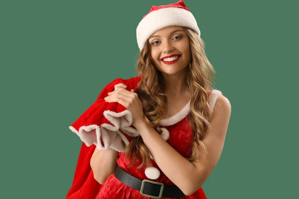 Pretty Young Woman Santa Costume Bag Green Background — Stock Photo, Image