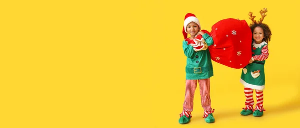Cute Little Elves Holding Santa Bag Yellow Background Space Text — Stock Photo, Image