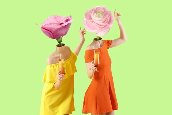 Happy Young Women Pink Flowers Instead Heads Cocktails Green Background — Stock Photo, Image