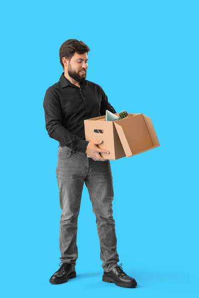 Fired Young Man Holding Box His Office Stuff Blue Background — Stock Photo, Image