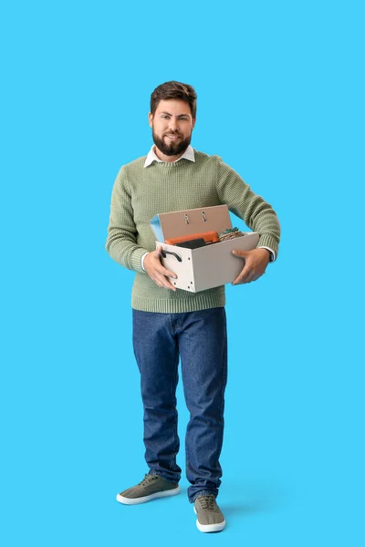 Smiling Fired Young Man Holding Box Personal Stuff Blue Background — Stock Photo, Image