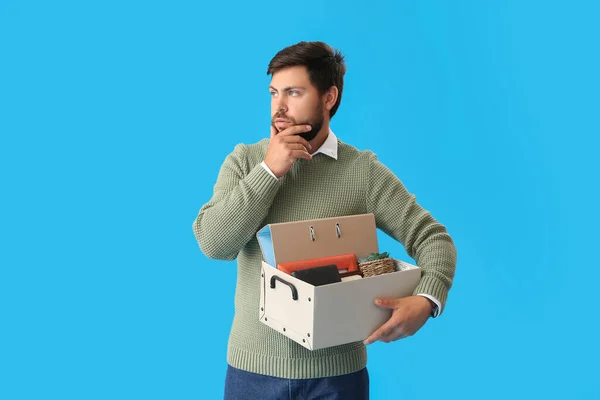 Sad Fired Young Man Holding Box Personal Stuff Blue Background — Stock Photo, Image