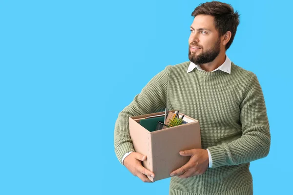 Smiling Fired Young Man Holding Box Personal Stuff Blue Background — Stock Photo, Image