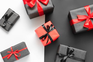 Gift boxes on color background. Black Friday sale
