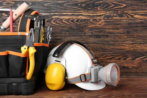 Hearing Protectors Hardhat Flashlight Bag Dark Wooden Background — Stock Photo, Image