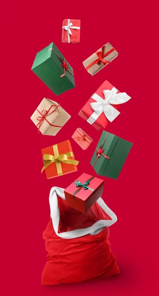 Santa Bag Flying Gift Boxes Red Background — Stock Photo, Image