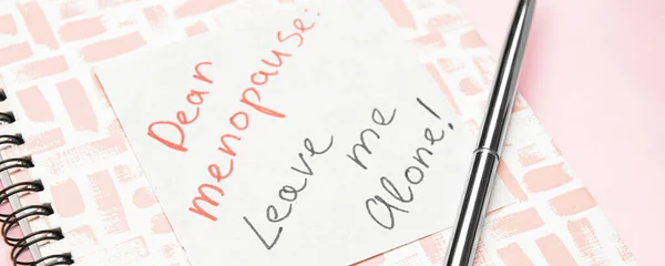 Notebook Paper Text Dear Menopause Leave Alone Pink Background Closeup — 스톡 사진