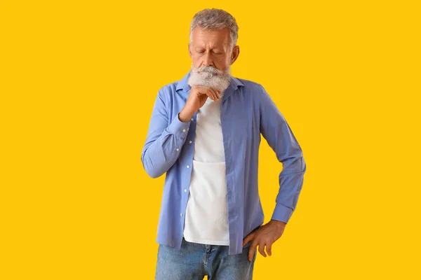 Thoughtful Mature Man Yellow Background — Stock Photo, Image