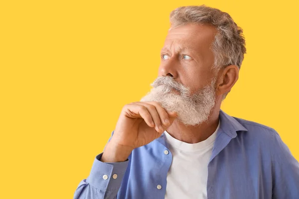 Thoughtful Mature Man Yellow Background Closeup — Stock Photo, Image