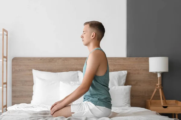 Young Man Meditating Bed Home — Stock Photo, Image