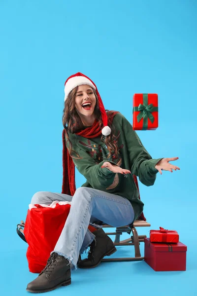 Beautiful Woman Santa Hat Bag Christmas Presents Blue Background — Stock Photo, Image