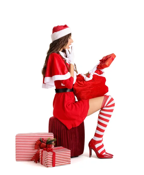 Surprised Young Woman Santa Costume Bag Christmas Gift Sitting White — Stock Photo, Image