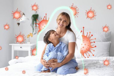 Annesi yatakta oturan küçük bir çocuk. Güçlü bağışıklık kavramı