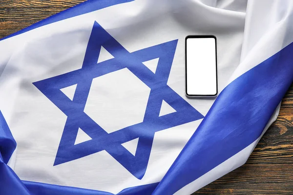 Σημαία Ισραήλ Και Κινητό Τηλέφωνο Ξύλινο Φόντο — Φωτογραφία Αρχείου