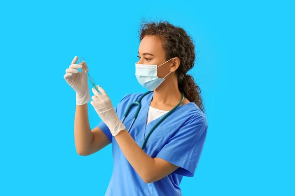 Female Doctor Medical Mask Syringe Ampule Blue Background — Stock Photo, Image