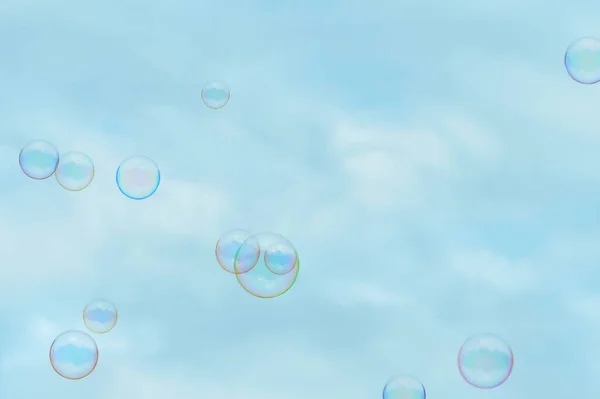 Soap bubbles on blue sky background