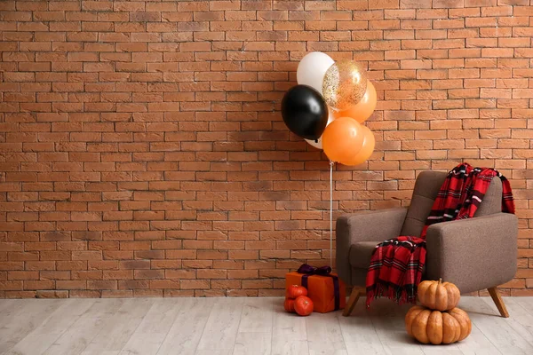 Armchair Halloween Pumpkins Gift Balloons Brick Wall — Stock Photo, Image
