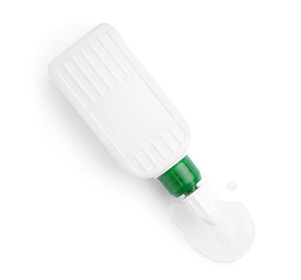 Bottle with spilled glue on white background