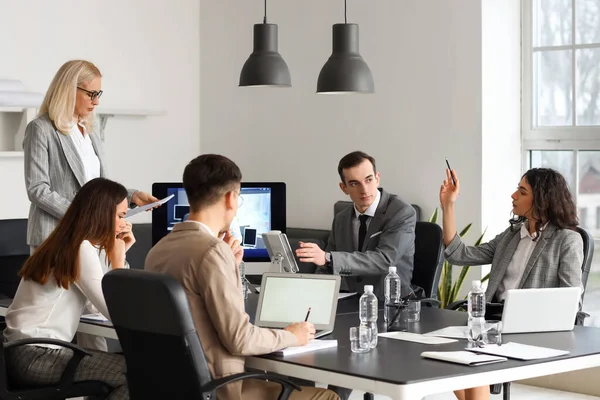 Business people having online meeting in office