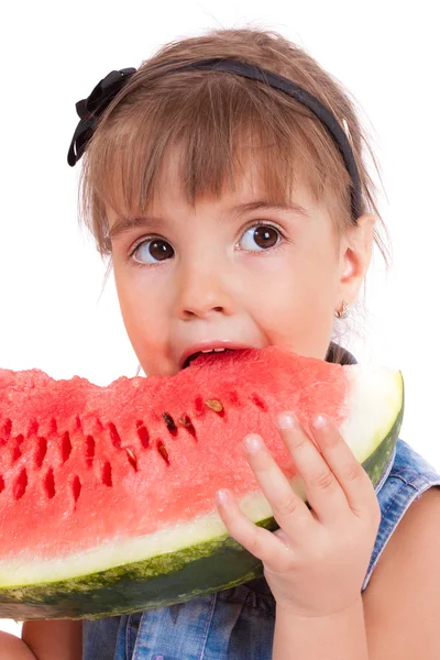 Grappig meisje eten een watermeloen — Stockfoto